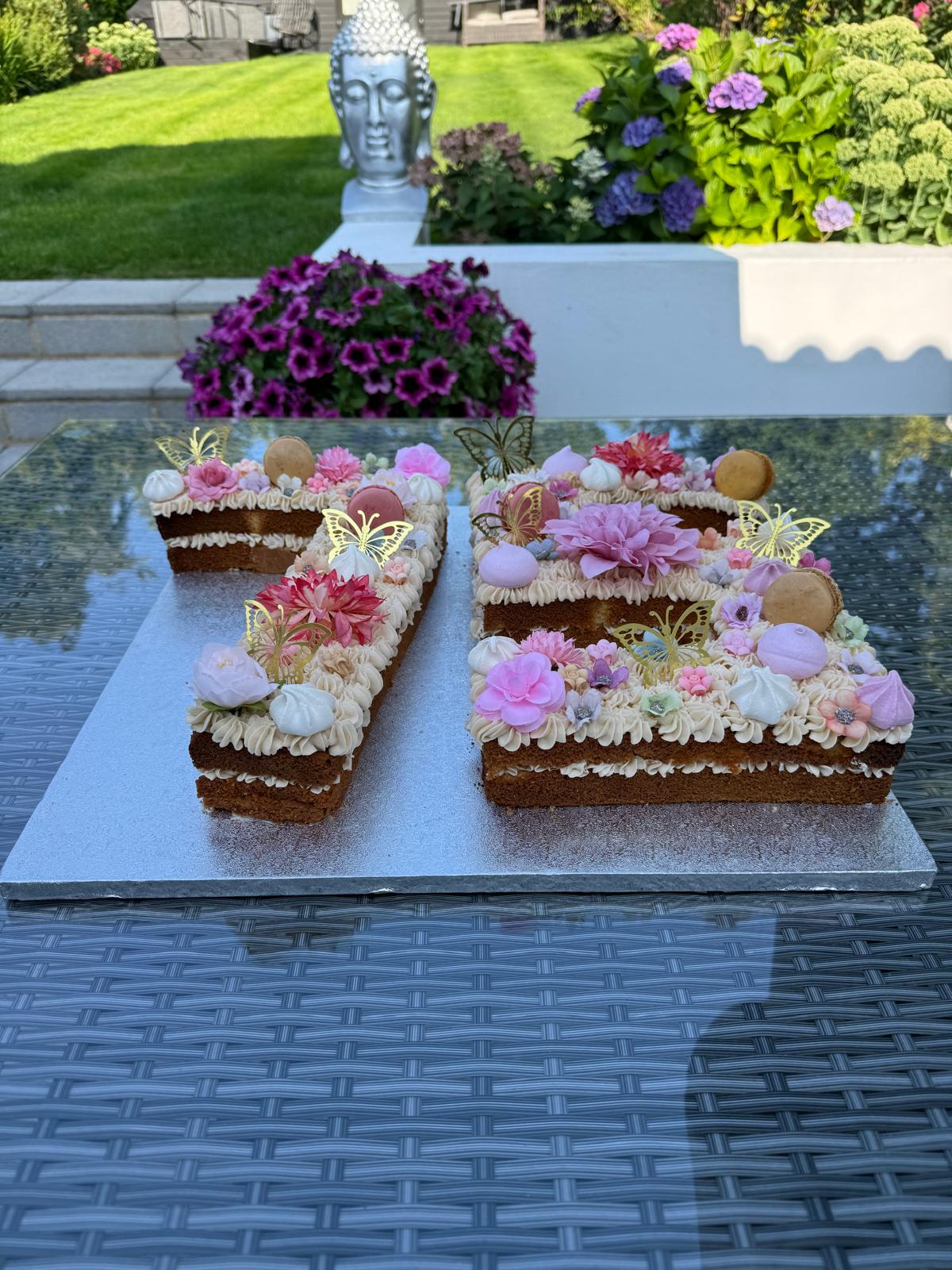 Floral letter celebration cake by Millie Moo Bakes